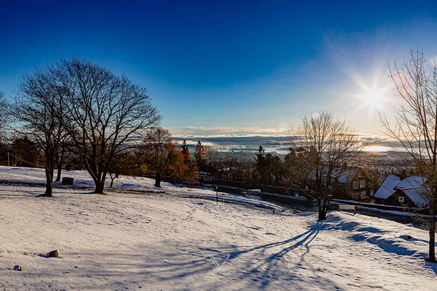 Sightseeing Oslo - Holmenkollen - view ski jump - Holmenkollen ski jump view over Oslo as winter sports place. Top sightseeing and travel tips Oslo. View from the ski jump, Sightseeing Oslo