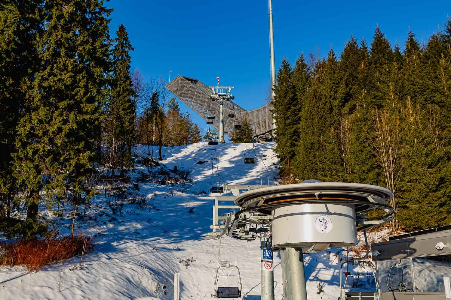 Sightseeing Oslo - Holmenkollen - view ski jump - Holmenkollen ski jump view over Oslo as winter sports place. Top sightseeing and travel tips Oslo. View from the ski jump, Sightseeing Oslo