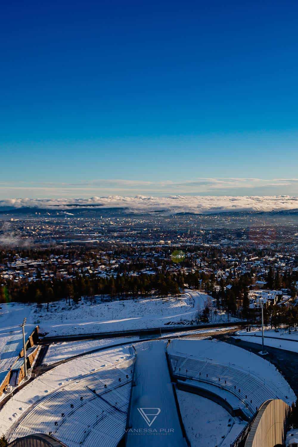 Sightseeing Oslo - Holmenkollen - view ski jump - Holmenkollen ski jump view over Oslo as winter sports place. Top sightseeing and travel tips Oslo. View from the ski jump, Sightseeing Oslo