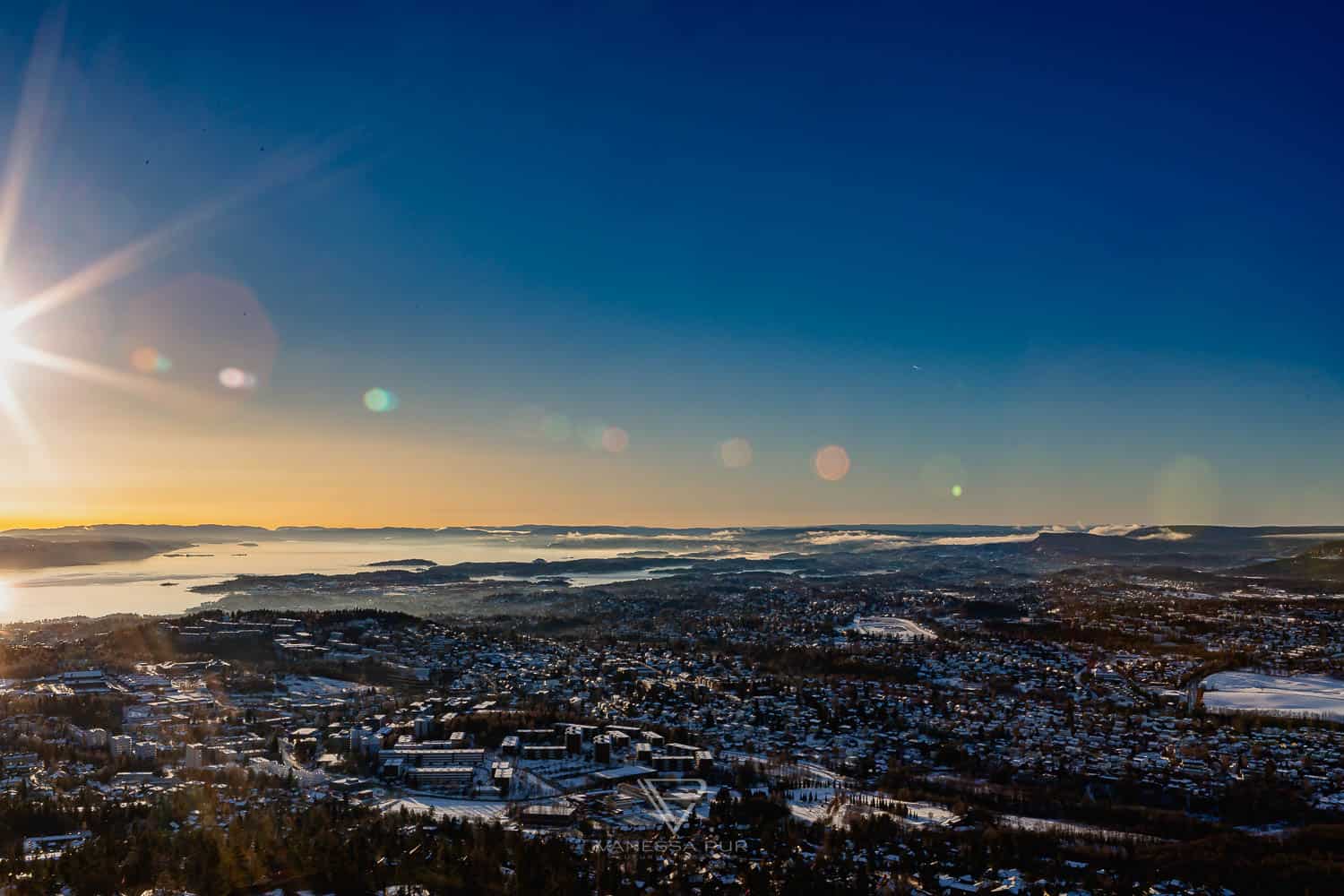 Sightseeing Oslo - Holmenkollen - view ski jump - Holmenkollen ski jump view over Oslo as winter sports place. Top sightseeing and travel tips Oslo. View from the ski jump, Sightseeing Oslo